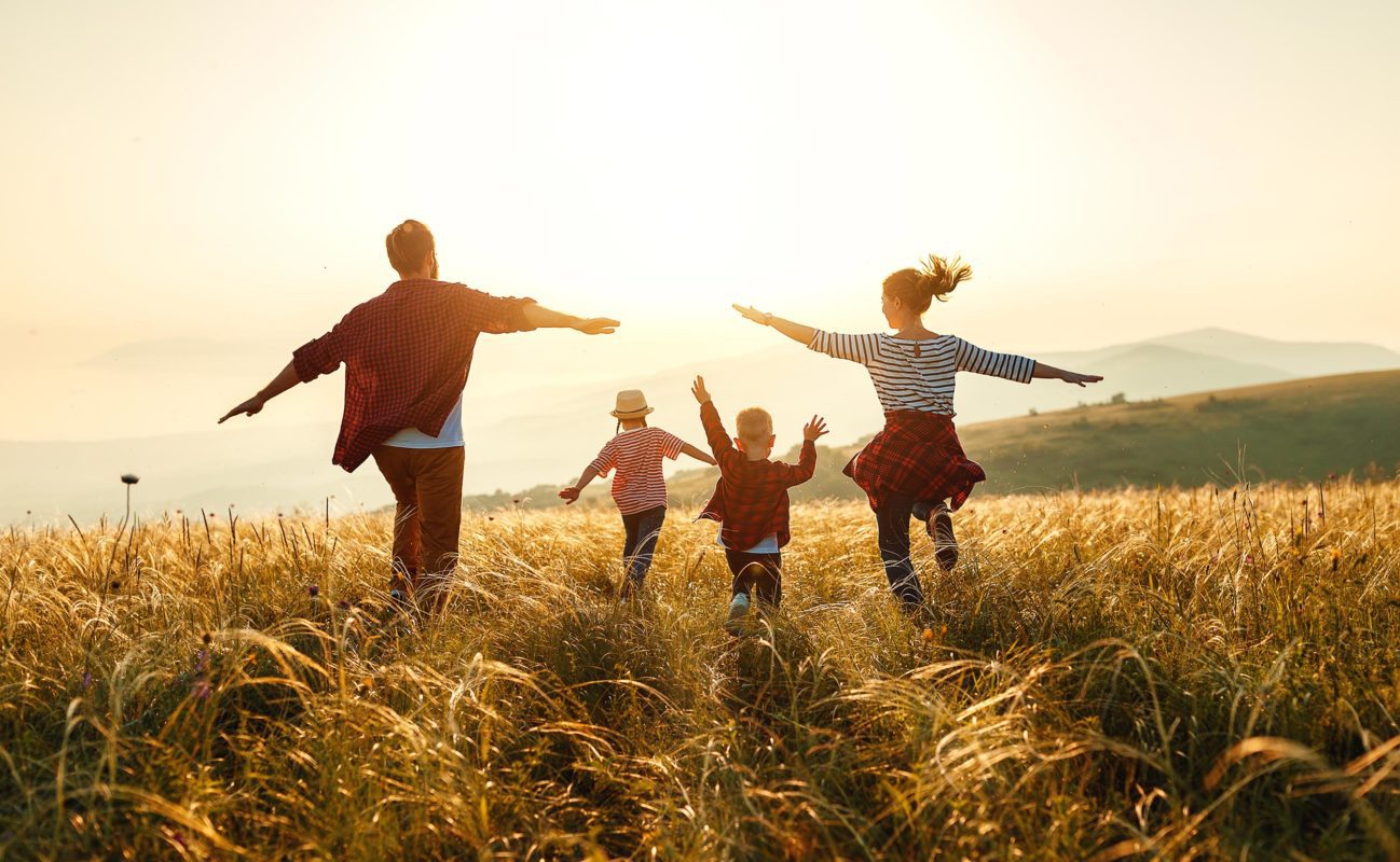 Family walking in field